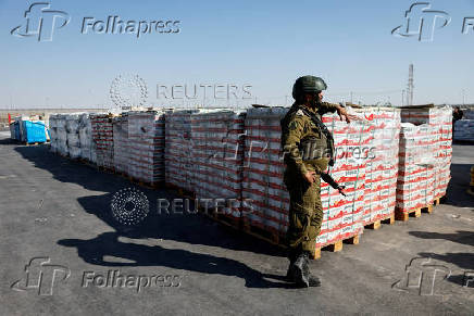 Humanitarian aid is waited to be transferred into Gaza from Israel, at the Gaza part of the Kerem Shalom crossing in the Gaza Strip