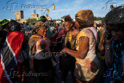 Revelers attend J'ouvert celebration on the day of the annual West Indian Day parade in the Brooklyn borough of New York