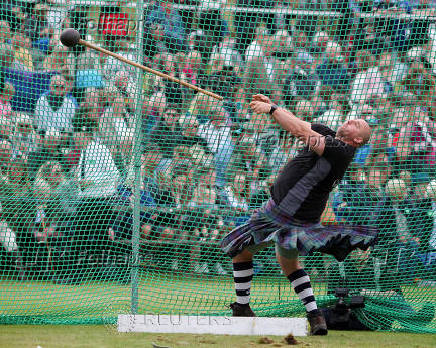 A competitor takes part in the Heavies event during the Braemar Royal Highland Gathering at the Princess Royal and Duke of Fife Memorial Park in Braemar, Scotland