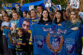 Relatives of Ukrainian prisoners of war wait for their arrival after a swap in an undisclosed location in Ukraine
