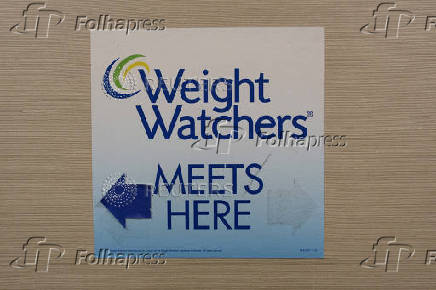 FILE PHOTO: Sign for Weight Watchers is displayed at an office in New York