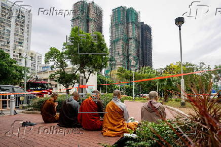 Roadside memorial for victims of the high-rise apartment fire in Hong Kong