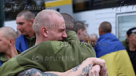 Ukrainian POWs are seen after a swap at an unknown location in Ukraine