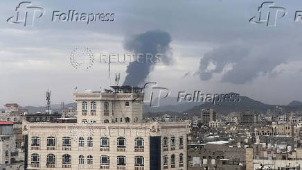 Smoke billows after an Israeli airstrike on Houthi infrastructure, in Sana'a