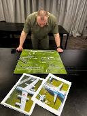 Head of the Ukraine's Security Service Maliuk looks at a map of an airfield in an unknown location in Ukraine