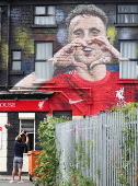 A mural honouring Diogo Jota appears in Liverpool