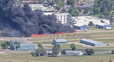 Smoke rises following a plane crash at Kalispell City Airport