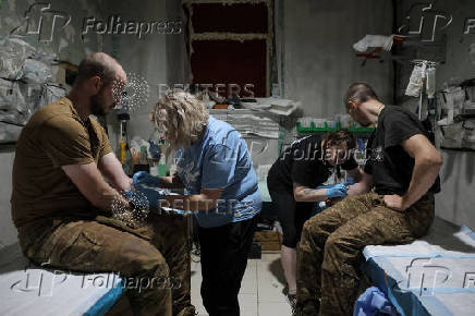 Ukrainian Armed Forces combat medics treat injured servicemen near Chasiv Yar