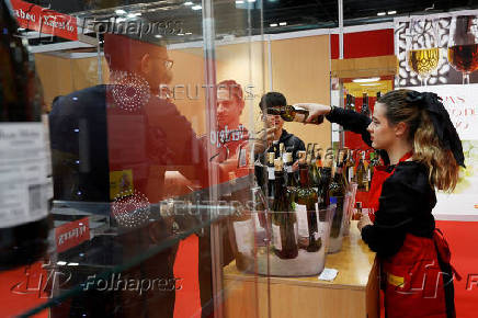 People sample different types of wine amid the newly imposed U.S. tariffs at the 38th Gourmets Fair in Madrid