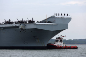 Britain's HMS Prince of Wales aircraft carrier arrives at Marina Bay Cruise Centre in Singapore