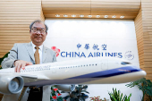 George Kao, Chairman of Taiwan's China Airlines poses for photos in Taoyuan