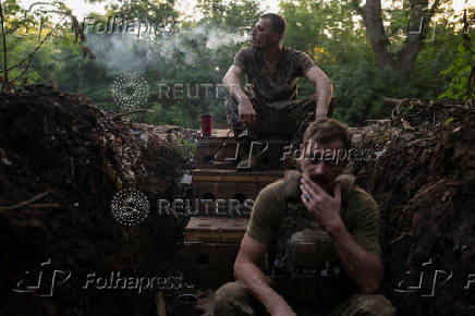 Ukrainian servicemen rest at a position on a front line near the city of Kostiantynivka