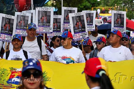 Demonstrators march to demand the return of Venezuelan migrant children after their parents were deported from the U.S., in Caracas