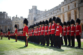 Members of The Coldstream Guards stand inside the Quadrangle ahead of a ceremony at Windsor Castle