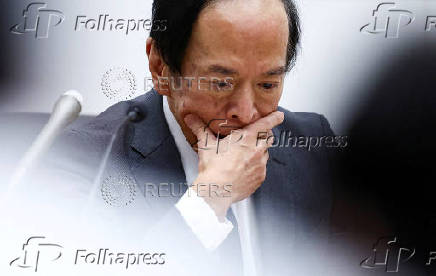 FILE PHOTO: Bank of Japan Governor Kazuo Ueda attends a press conference after its policy meeting in Tokyo