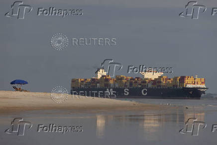 Container ship sail on the Atlantic Ocean off the coast of Tybee Island, Georgia