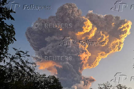 Mount Lewotobi Laki-laki spews smoke and volcanic ash as seen from Kawalelo village in East Nusa Tenggara province