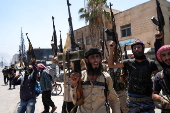 Fighters from Bedouin tribes deploy in the Druze-majority town of Mazra'a