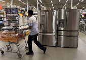 FILE PHOTO: People shop at a Home Depot in Washington