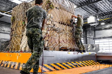 Dutch cargo plane is prepared in Eindhoven for airdropping humanitarian aid over Gaza
