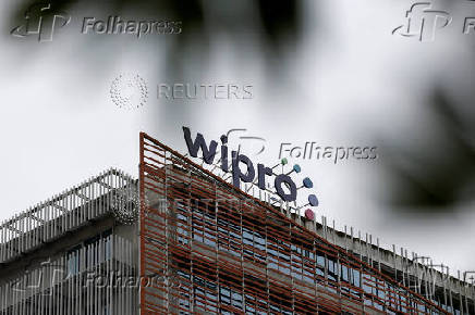 The logo of Wipro is displayed inside its premises in Bengaluru