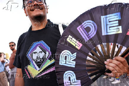 LGBTQ Pilgrims walk toward St. Peter's Basilica