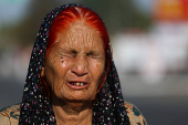 Pakistan citizen Wakeela cries as she talks to media as she and her relatives prepare to leave India after India revoked all visas issued to Pakistani citizens at the Attari-Wagah border crossing near Amritsar