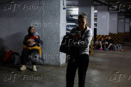 Residents take shelter during Russian drone and missile attacks in Kyiv