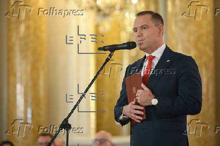 Polish President-elect Karol Nawrocki receives the winning certificate