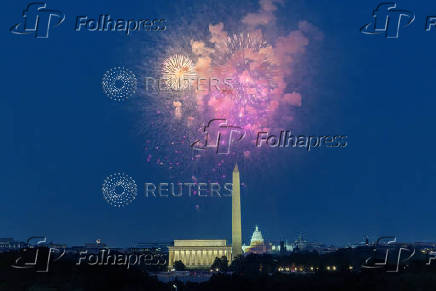Fireworks explode over the National Mall during Fourth of July celebrations in Washington