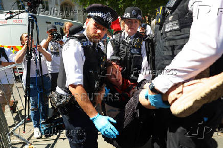 People gather in Parliament Square calling for the de-proscription of the Palestine Action group, in London