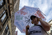 Demonstrators gather during a 