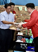 President Ferdinand Marcos visits a relief goods warehouse in Manila as Tropical Storm 'Crising apporaches