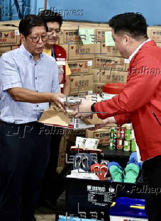 President Ferdinand Marcos visits a relief goods warehouse in Manila as Tropical Storm 'Crising apporaches