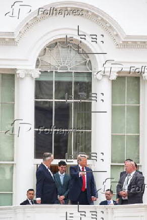 US President Trump walks on roof of the West Wing of the White House