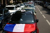 French taxi drivers protest near the Bercy Economy and Finance Ministry in Paris
