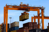 FILE PHOTO: A container is loaded onto a cargo ship while docked at Hai Phong port in Vietnam