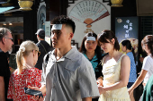 FILE PHOTO: People put cooling gel sheets on their foreheads to cool themselves amid a yellow alert for heat, in Shanghai