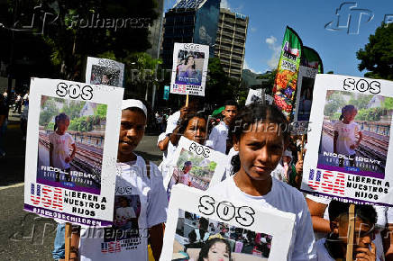 Demonstrators march to demand the return of Venezuelan migrant children after their parents were deported from the U.S., in Caracas