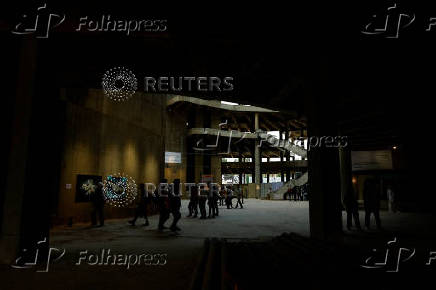 Visitors walk through the