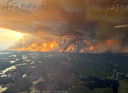 Smoke rises from a wildfire which has prompted a pre-evacuation notice in Flin Flon