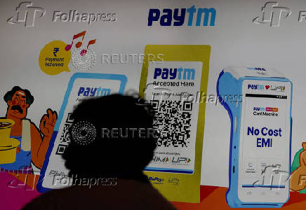 FILE PHOTO: A man stands at the Paytm stall during the Global Fintech Fest in Mumbai
