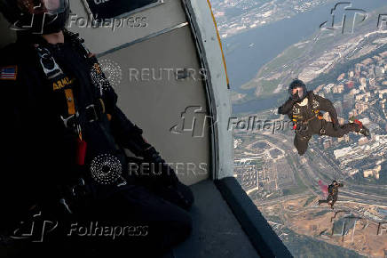 U.S. Army Golden Knights parachute team perform during the Twilight Tattoo ceremony