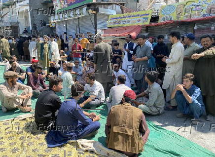 Mass funeral of 8 volunteers killed in a landslide near the Chinese border in Gilgit