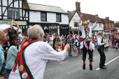 Members of the Merrydowners Morris dancing troupe perform at a St. George's Day celebration, in London
