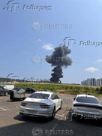 A general view shows smoke billowing after a South Korean navy maritime patrol aircraft crashed