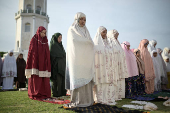 Indonesian Muslim women attend mass prayers at Baiturrahman mosque during Eid al-Adha, in Banda Aceh