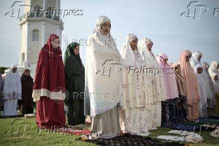 Indonesian Muslim women attend mass prayers at Baiturrahman mosque during Eid al-Adha, in Banda Aceh