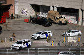 U.S. Marines stand guard outside the Edward R. Roybal Federal Building, in Los Angeles