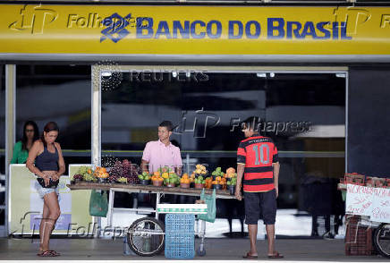 FILE PHOTO: Street vendors are seen in front of a Banco do Brasil branch in Brasilia
